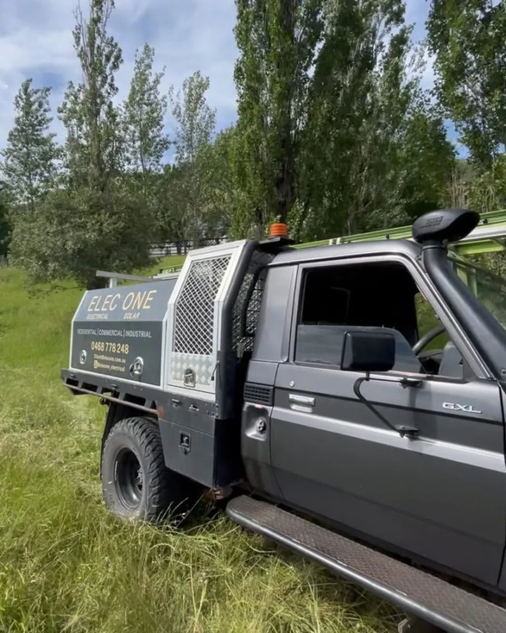 Elec One branded work ute parked on site