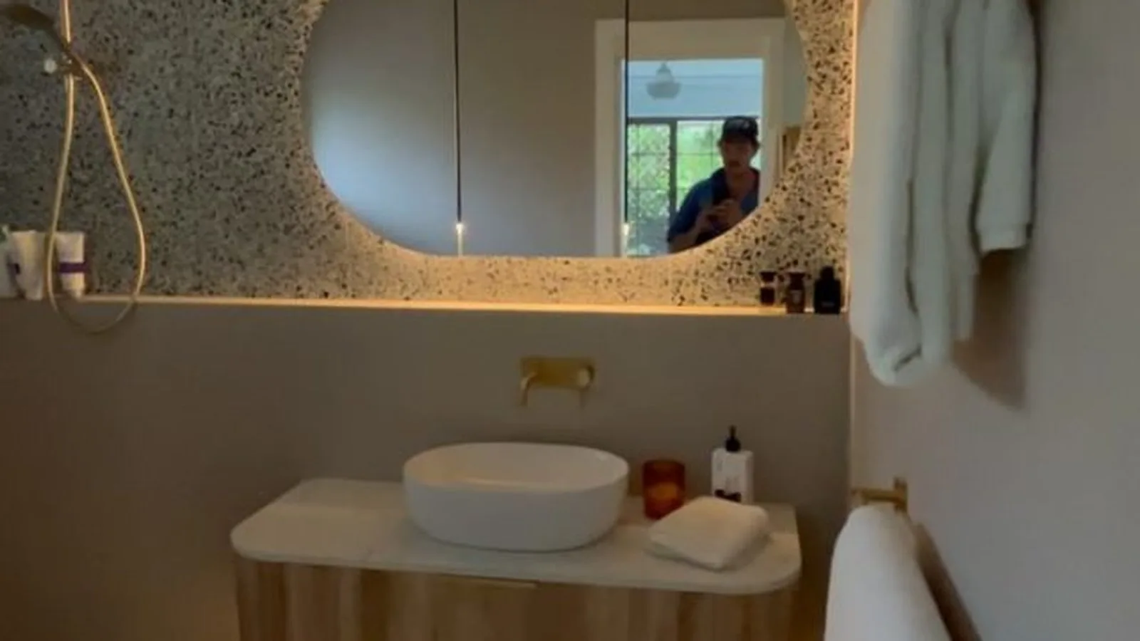 Warm LED lighting installed above a bathroom vanity and mirror