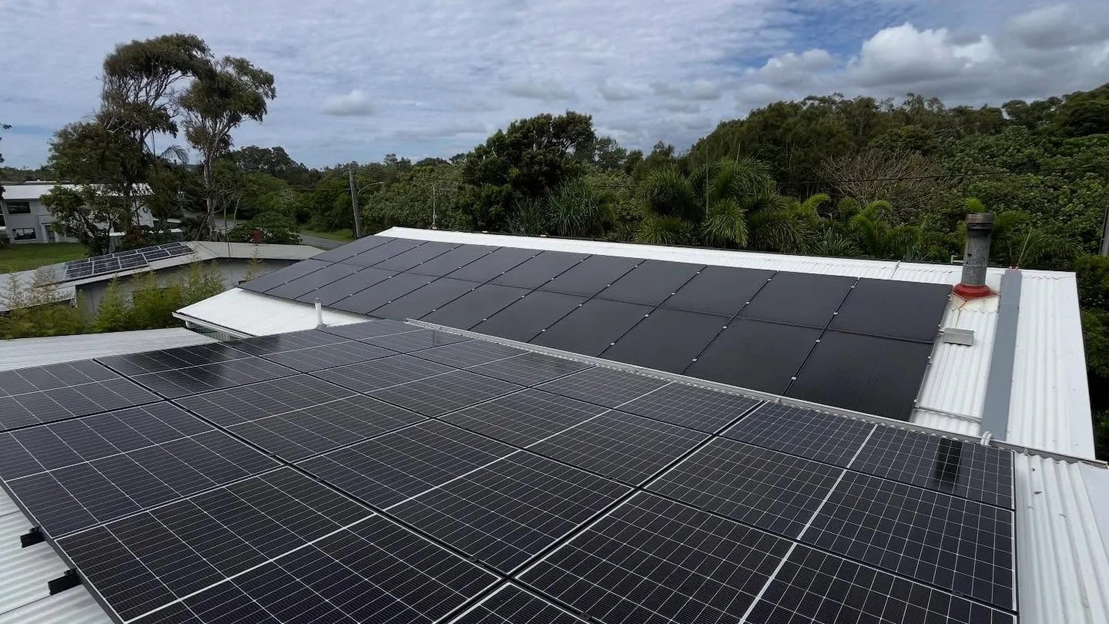 Solar panels installed across a metal roof by Elec One